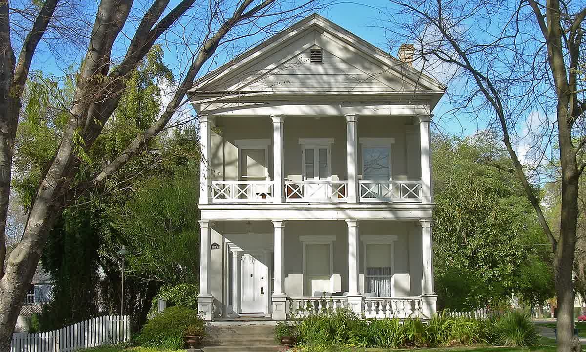 Two-story Greek Revival house with a double front porch, built in 1856